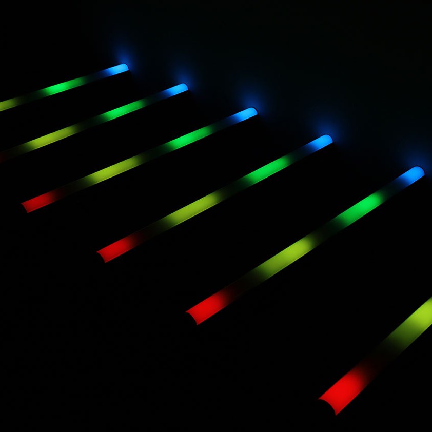 AVSL QTX Pixelator 144 RGB Pixel LED effects bars angled in a row, glowing in red, yellow, green and blue zones against a black background.