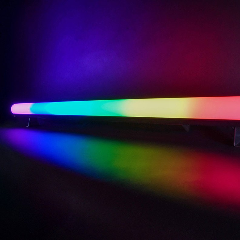 AVSL QTX Pixelator 144 RGB Pixel LED effects bar lit in rainbow zones across its length, casting a coloured spectrum onto the floor below.