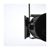Side view of the Citronic MFZ100-W mini Fresnel LED stage light by AVSL in matte black, with barn doors and mounting bracket, on a white background.
