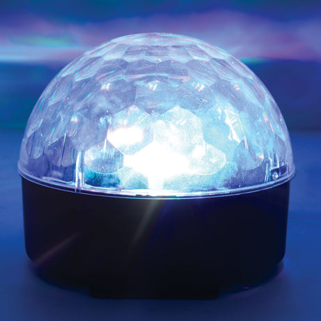 QTX Moonglow disco ball light effect with six LEDs glowing beneath a clear faceted polycarbonate dome on a black base, casting blue beams.