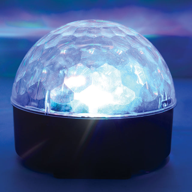 QTX Moonglow disco ball light effect with six LEDs glowing beneath a clear faceted polycarbonate dome on a black base, casting blue beams.