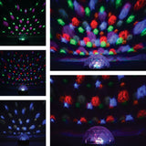 QTX Moonglow LED disco ball light with clear faceted polycarbonate dome, projecting red, green, blue and pink beam patterns across dark walls and ceilings.