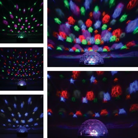 QTX Moonglow LED disco ball light with clear faceted polycarbonate dome, projecting red, green, blue and pink beam patterns across dark walls and ceilings.