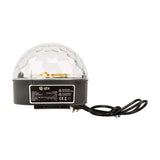 QTX Moonglow LED disco ball effect light with clear faceted polycarbonate dome, black base, specification label, and UK mains cable on white.
