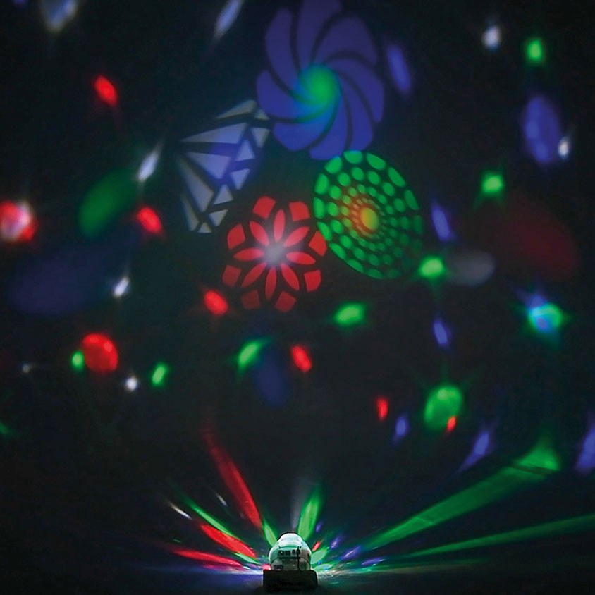 AVSL QTX Crystal Blaze RGBW tabletop LED light effect projecting red, green and blue GOBO patterns and coloured beams across a dark room.