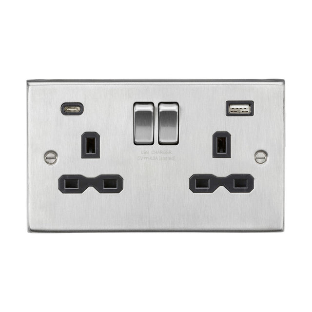 A brushed chrome finished power socket with black inserts, featuring a 13A two-gang single pole switched setup, dual USB A+C ports, and positioned on a white background. It includes two plug outlets with switches above, offering a 5V and 4.0A combined charge from the USB ports for versatile device charging.