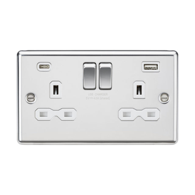 The 13A 2 Gang SP Switched Socket with Dual USB A+C features two standard plug outlets and dual USB charging ports, all in a polished chrome finish. It includes two centrally located switches and is perfect for modern electrical installations with its white insert and rounded edge design.