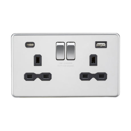 Introducing the 13A 2 Gang SP Switched Socket With Dual USB A+C in polished chrome with a black insert. This sleek electrical wall socket includes two UK-style three-pin plug outlets, dual USB chargers (Type A and C), and convenient toggle switches above. Its screwless low-profile design enhances any space with a modern touch, combining elegance and practicality in one sophisticated socket.