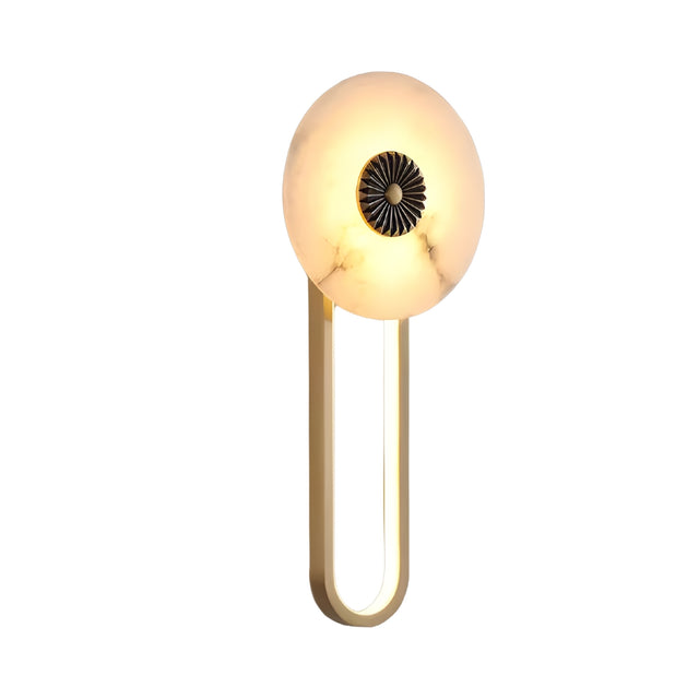 The Glintara LED Radiant Disc Alabaster Wall Light features a soft white, round alabaster shade with a brass accent center, elegantly mounted on a gold U-shaped metal base.