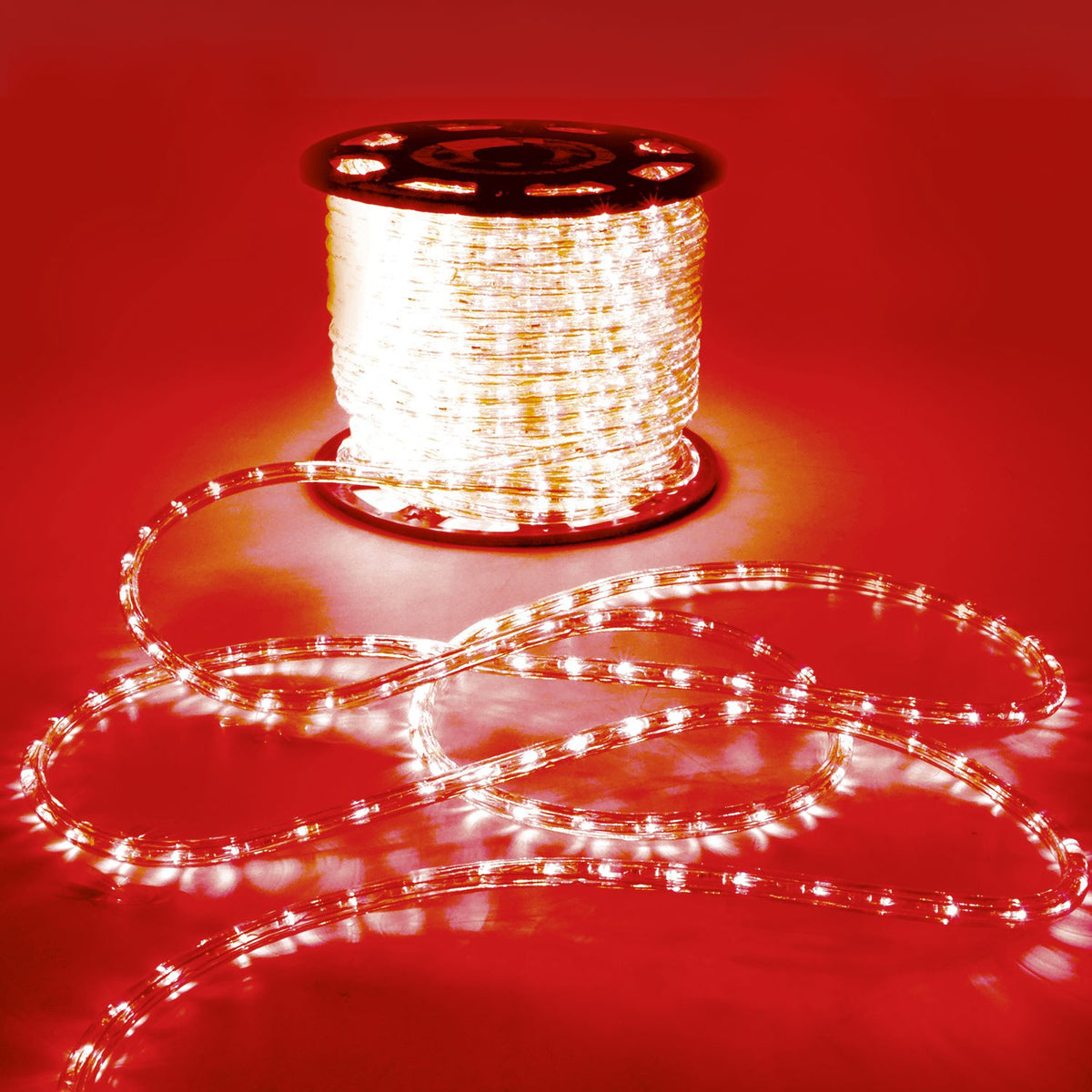 LYYT 50m LED rope light reel by AVSL, illuminated flexible tube coiled on a spool with loose length trailing across a red-lit surface.