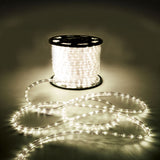 LYYT 50m LED rope light reel by AVSL, illuminated warm white 2800K, with clear flexible tubing coiled on the floor in a dim setting.