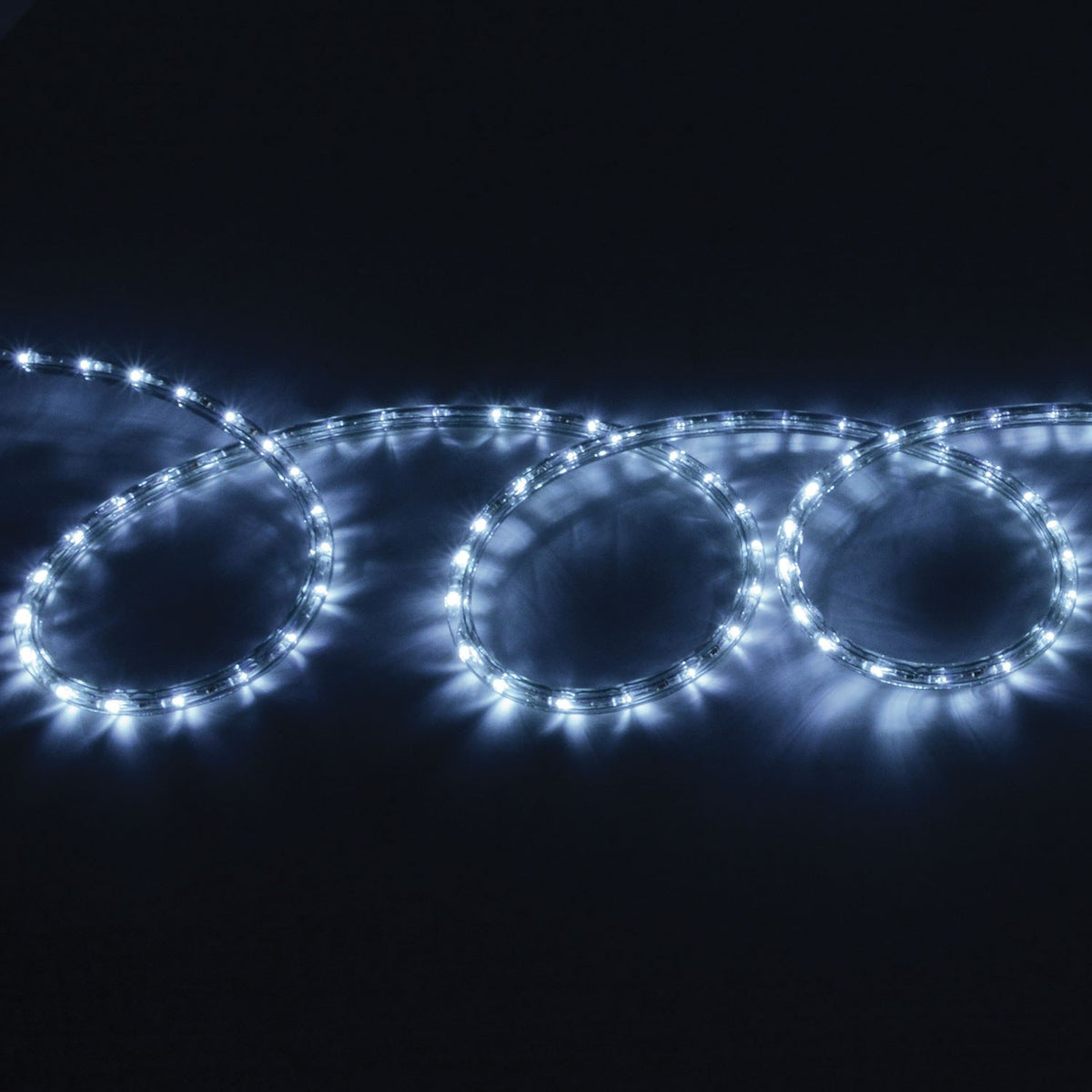 LYYT 50m LED rope light by AVSL coiled in loops, glowing cool white 5000K through a clear flexible tube against a dark background.