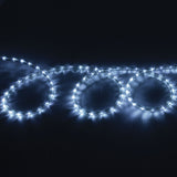 LYYT 50m LED rope light by AVSL coiled in loops, glowing cool white 5000K through a clear flexible tube against a dark background.