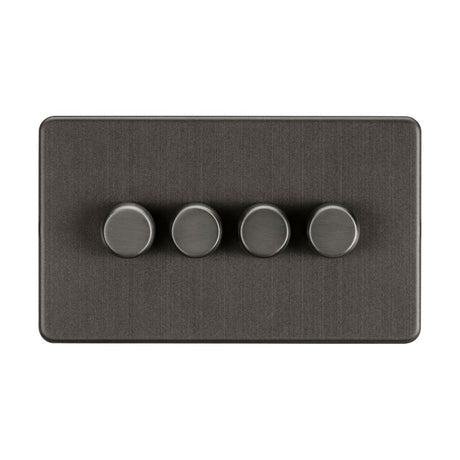 A sleek, screwless low profile smoked bronze rectangular light switch panel that features four round, evenly spaced trailing-edge dimmer knobs.