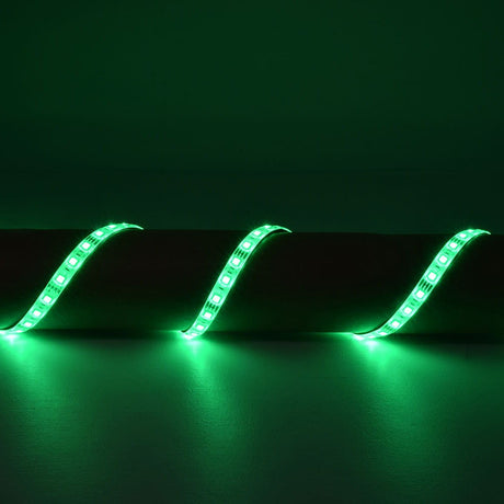 LYYT 5m RGB LED strip kit by AVSL illuminated in green, IP68 silicone tape shown in a wave arrangement casting green light across a dark surface.