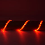 AVSL LYYT 5m RGB LED strip kit illuminated red in a draped wave arrangement, showing IP68 silicone tape with visible SMD LEDs casting a red glow.