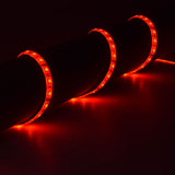 AVSL LYYT 5m RGB LED strip kit coiled and illuminated in red, showing the IP68 silicone tape with evenly spaced SMD LEDs glowing along its length.