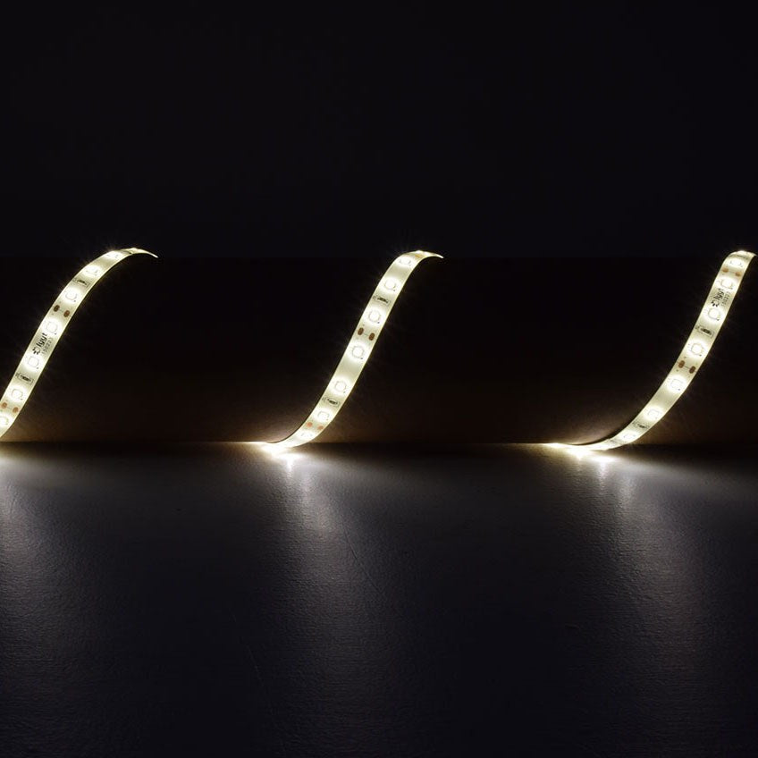 LYYT 5m warm white 3000K LED strip light kit by AVSL, IP65 tape shown illuminated in a curved run across a dark surface.