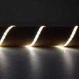 LYYT 12V LED strip light kit by AVSL installed in a wave pattern, emitting warm white 3000K glow against a dark grey background.