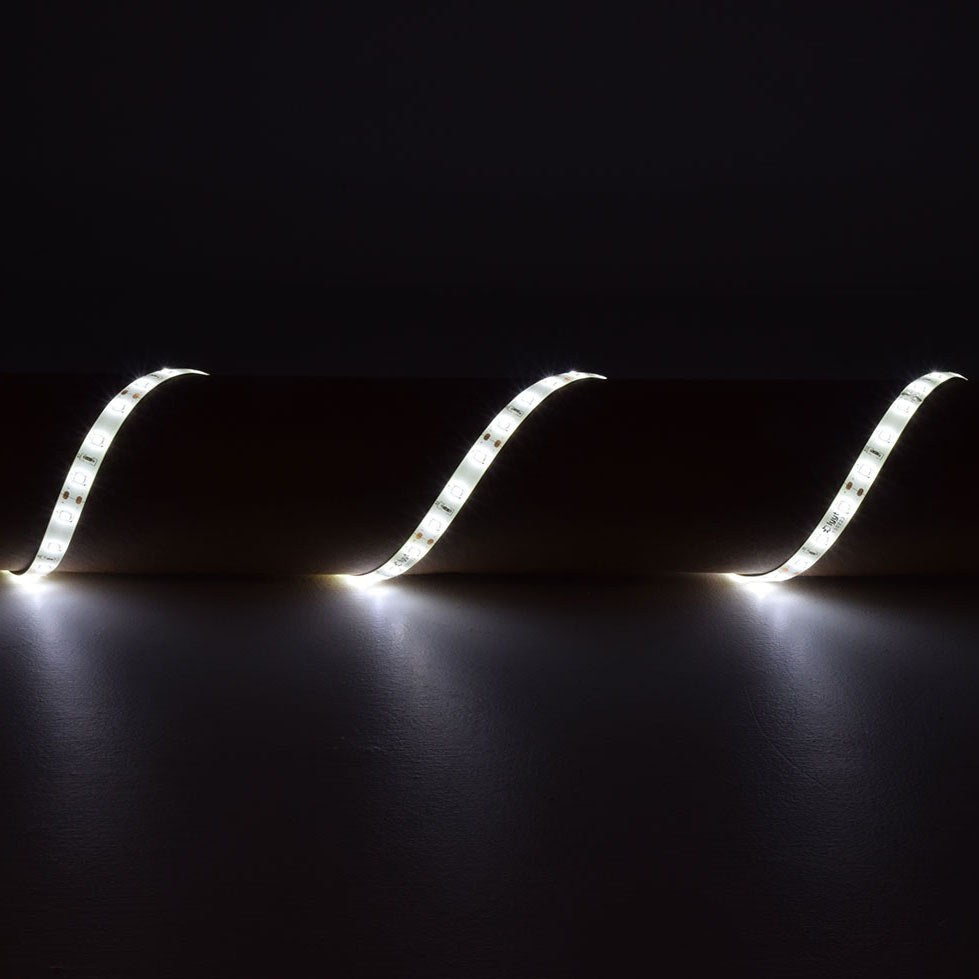 LYYT 12V LED strip light kit shown as three illuminated cool white 6000K tape sections draped on a dark surface, IP65 silicone-coated flexible LED tape.