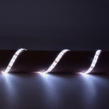 LYYT DIY-RGB30 RGB LED strip light kit by AVSL shown lit in white across three curved loops on a dark surface, IP65 silicone-coated flexible tape.