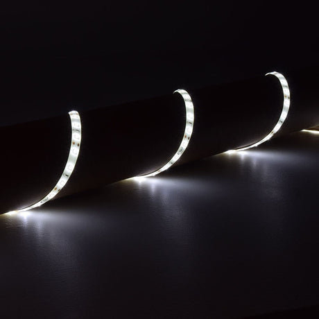 LYYT DIY-DW120 waterproof LED strip by AVSL, 5m flexible tape coiled along a dark surface and illuminated in cool white.