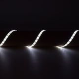 LYYT DIY-DW120 waterproof LED strip by AVSL, 5m flexible tape illuminated in cool white and arranged in a wave across a dark surface.