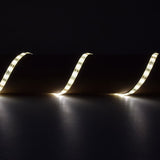 LYYT DIY-DW120 waterproof LED strip by AVSL, flexible tape curving across a dark surface, lit in warm white with a soft even glow.