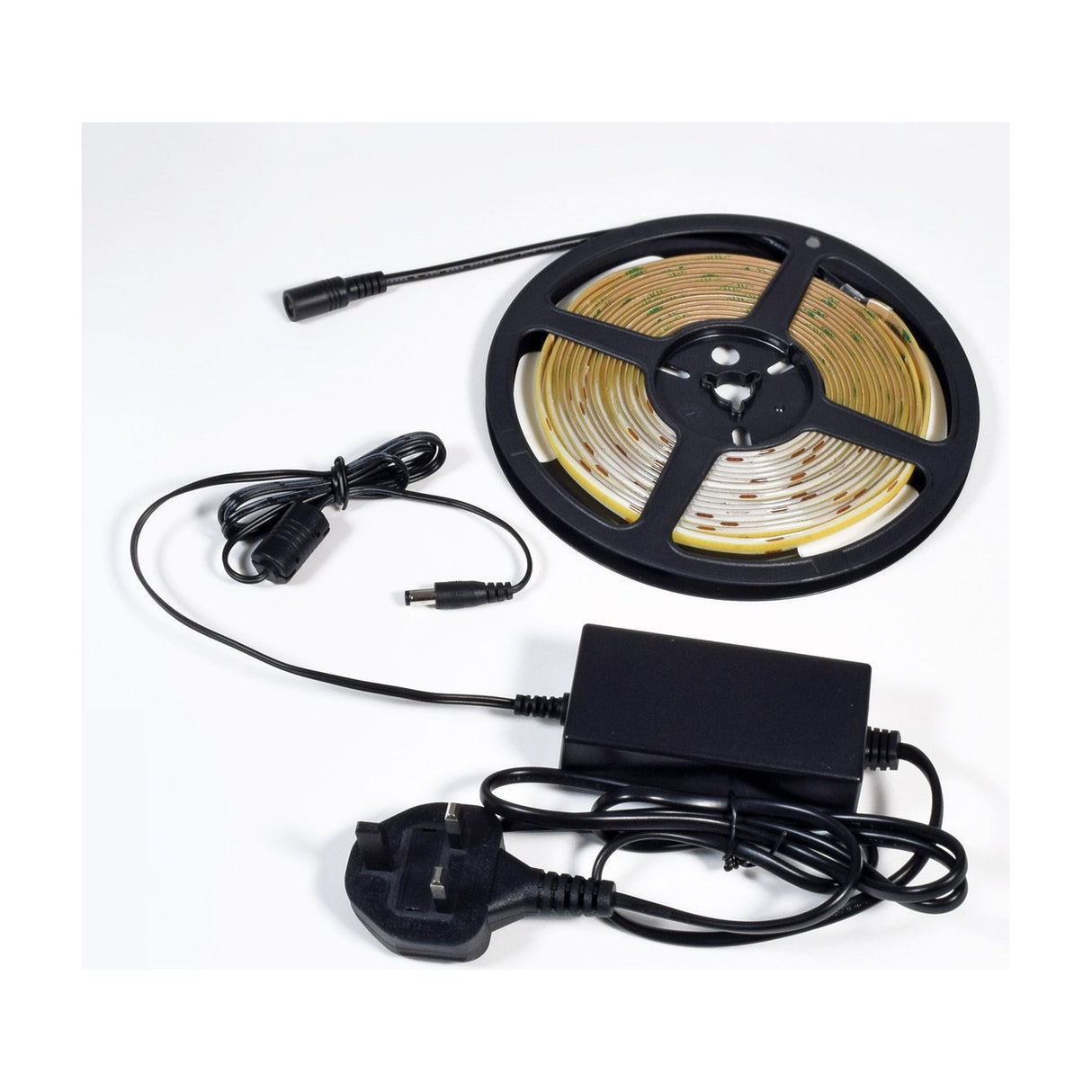 LYYT COBKITWW 24V COB 5m warm white LED tape kit on a reel with UK plug power supply and connector lead on a plain white background.
