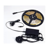 LYYT COBKITWW 24V COB 5m warm white LED tape kit on a reel with UK plug power supply and connector lead on a plain white background.