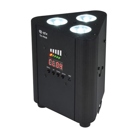 QTX Tri-PAR rechargeable RGBW LED par uplighter in matte black metal housing with three illuminated LEDs, four-button control panel and digital display.