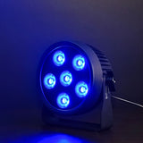 Citronic SilentPAR-180 RGBWA+UV PAR can by AVSL with six COB LEDs lit blue, shown on a bracket stand against a dark background.