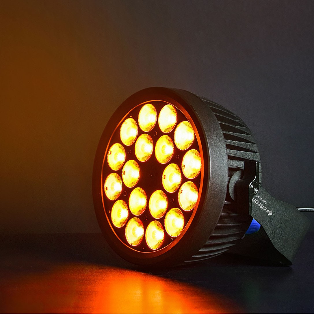 Citronic SilentPAR-216 RGBWA+UV PAR can by AVSL, matte black metal chassis with 18 LEDs lit amber, shown at an angle on a dark background.