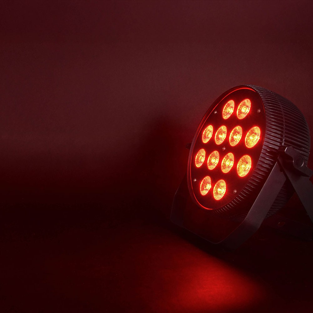Citronic MagicPAR-80B matt black fanless PAR can by AVSL with 12 RGBWA/UV LEDs glowing red on a tilting bracket against a dark background.