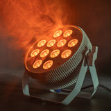 Citronic MagicPAR-80W fanless PAR can in white, angled on its bracket with 12 RGBWA/UV LEDs glowing amber through swirling haze.