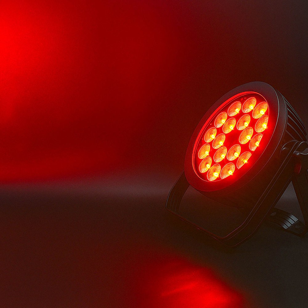 Citronic MagicPAR-220B matt black PAR can by AVSL, angled on its bracket with 18 LEDs lit red, casting a red wash across the background.
