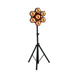 Citronic CosmoPAR seven-head RGBW COB LED PAR light in a snowflake layout, illuminated amber, mounted on a black tripod stand against a white background.