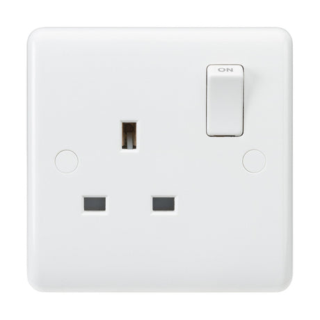 A white 13A 1 Gang SP Switched Socket, made of thermoset resin, features three rectangular pin holes and a switch in the on position. The socket is ASTA approved and BS 1363-2:2016 certified, mounted on a smooth, rounded-edge faceplate.