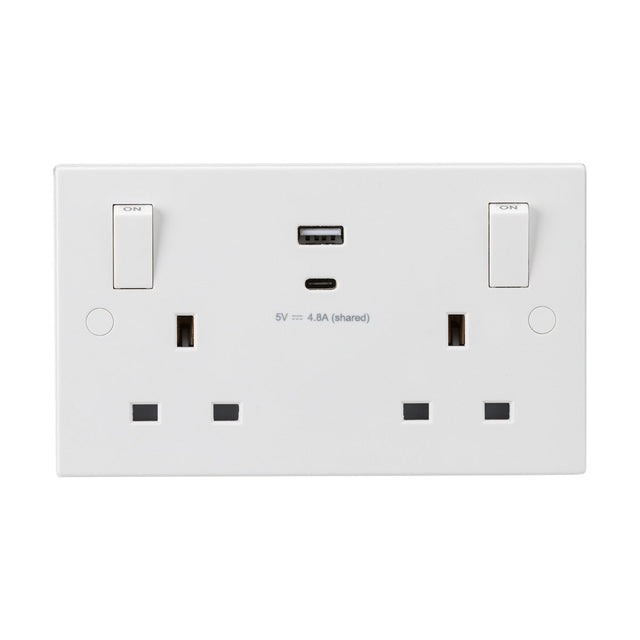 Square edge 13A 2 gang switched socket with dual USB charger (5V DC --- 4.8A shared), featuring outboard rockers and anti-microbial properties. Each switch is positioned above the sockets and labeled ON, combining minimalist design with modern functionality.