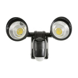 LYYT twin LED PIR floodlight in black with two round COB heads on ball-joint mounts and central motion sensor, shown on a plain white background.