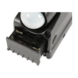 LYYT battery-powered LED PIR floodlight in black ABS with sensor dome and open AA battery compartment revealing spring contacts.