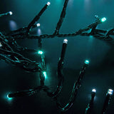 LYYT 960 LED cluster string lights by AVSL shown close-up with dark green cable and densely spaced cool white and blue LEDs glowing against a dark background.