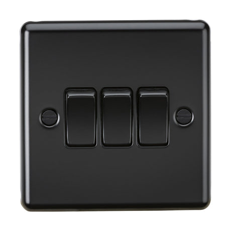 A 10AX 3 Gang 2-Way Switch in matt black with a rounded edge metal design is mounted on the wall. Each switch is positioned vertically, featuring screws visible on either side of the glossy plate.