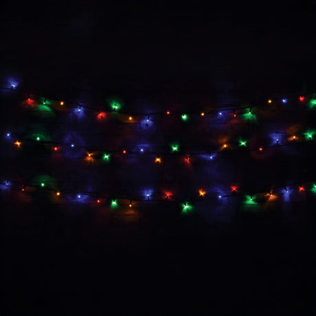 The LYYT 90 LED Heavy Duty String Lights, spanning 10 meters, cast a radiant glow against the darkness with energy-efficient RGBA bulbs in red, green, blue, and amber. Specifically designed for outdoor environments, these lights are arranged horizontally in multiple rows to create a colorful and festive atmosphere against a black background.