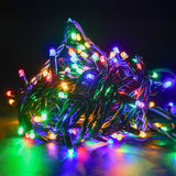 LYYT HD180S-MC heavy duty festoon string lights coiled with RGBA red, green, blue and amber LEDs lit on a black rubber cable against a dark background.
