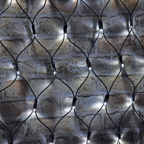 AVSL LYYT 144NET-CW cool white connectable net light with black rubber cable mesh and evenly spaced LEDs draped over a rustic brick wall.