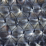AVSL LYYT 144NET-CW cool white net light with 144 LEDs on a black rubber diamond-mesh cable draped over an exposed brick wall.