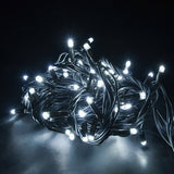 LYYT heavy duty festoon string lights coiled and illuminated in cool white, showing concave LED heads along a black UV-resistant rubber cable.