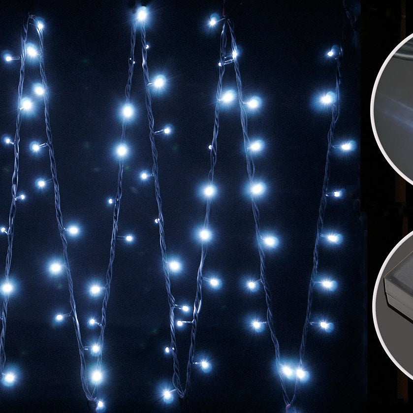 LYYT HD180C-WHT Cool White Connectable Festoon Lights by AVSL, shown lit at night with cool white LEDs draped vertically on black cables.