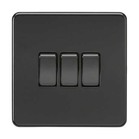 The 10AX 3 Gang 2-Way Switch in Matt Black features a sleek, screwless design with three toggle switches arranged horizontally. Its low profile and matt black finish offer a modern aesthetic, beautifully complementing a plain white background.